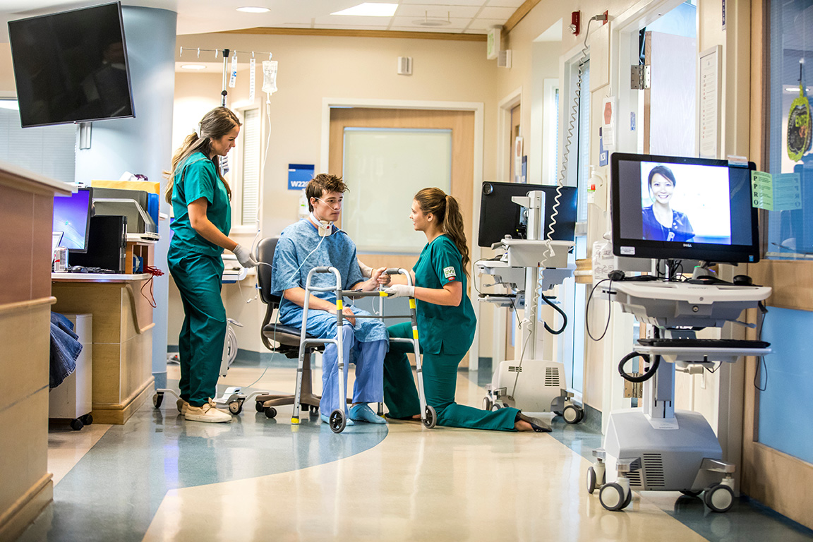 man in wheelchair in hospital