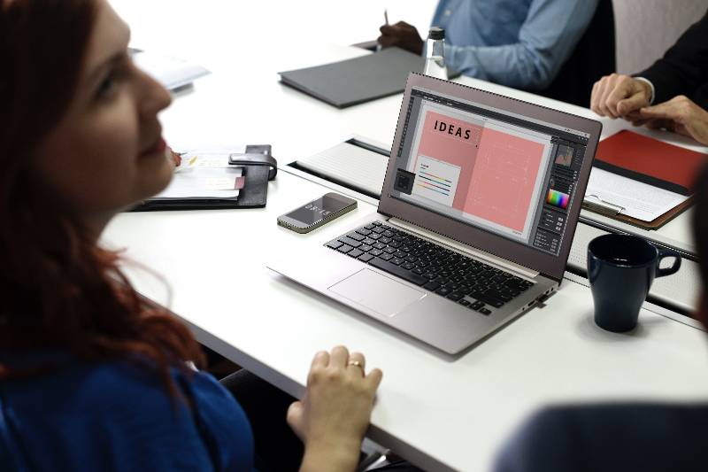 Designer sitting near a laptop