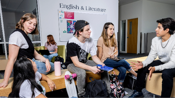 Group of students sitting together in conversation.