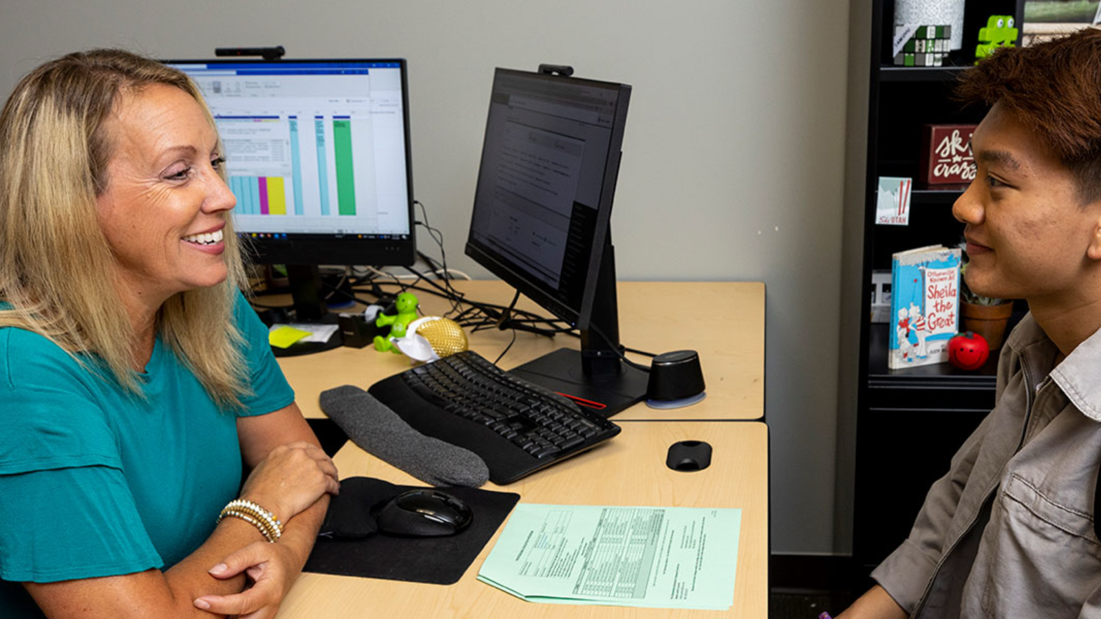 Student and advisor in conversation.