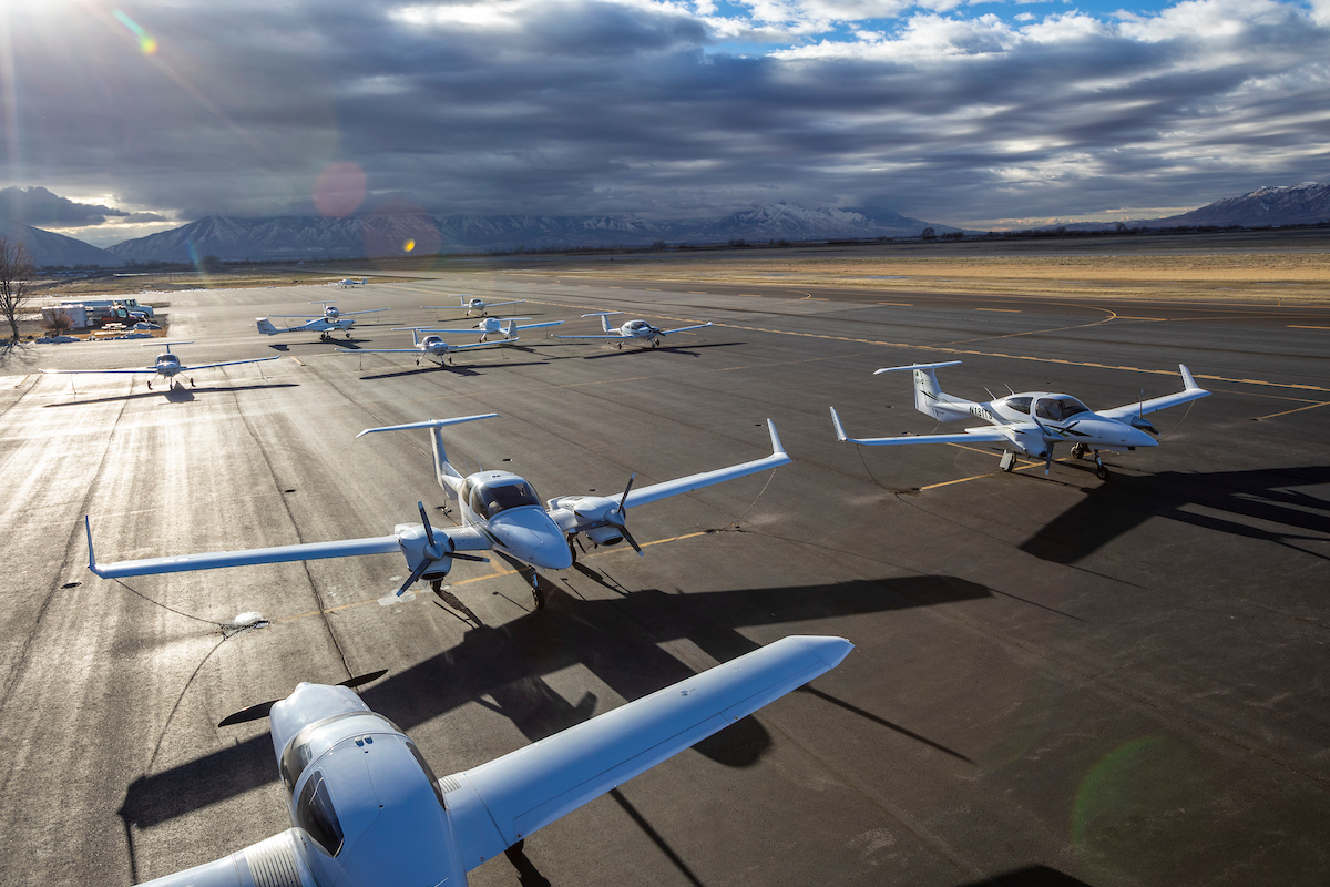 Airplanes lined up on a tarmac