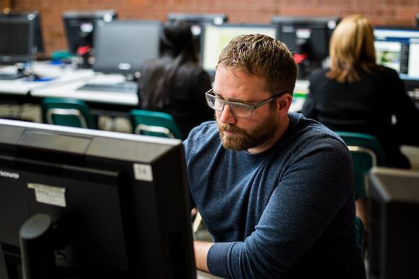 A student sitting at a computer