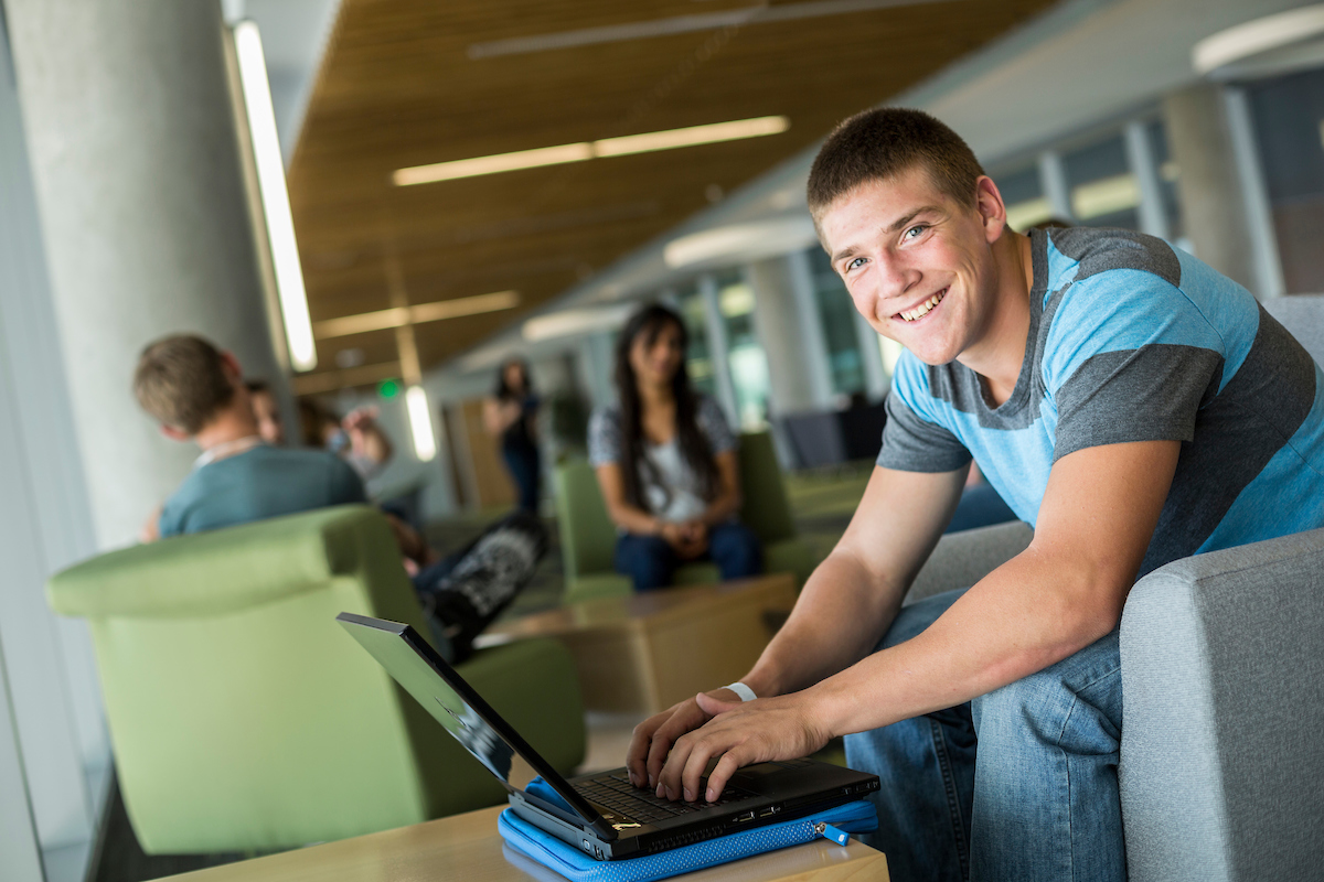 Male Student on a computer