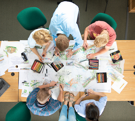 An overhead shot of people studying together at a table