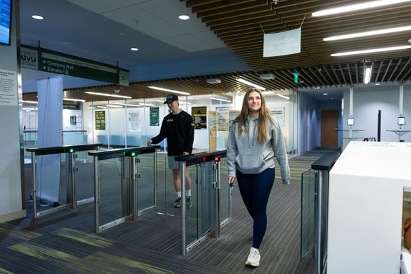 Students checking in at the entrace of the UVU gym in the Student Life and Wellness Center