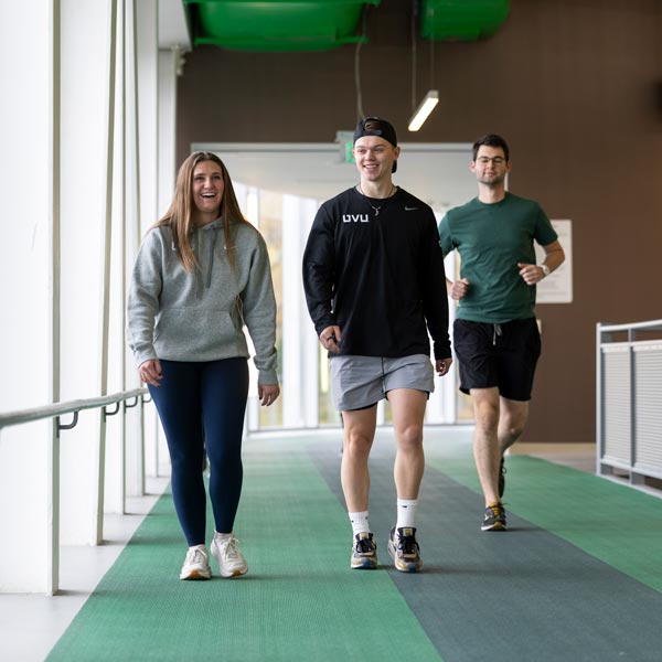 Students running on the UVU indoor track