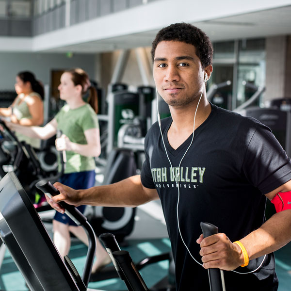 Student on a cardio maching in the UVU fitness center