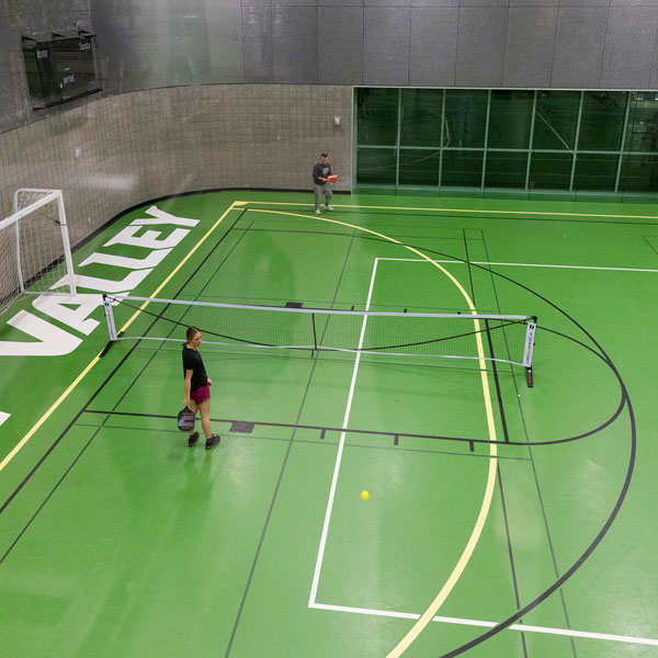 Student playing on the UVU fitness facility Multi-activity (MAC) courts