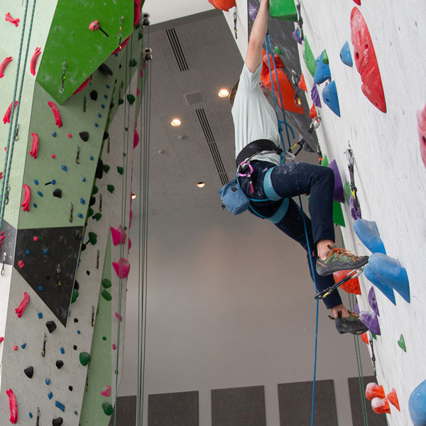 Student climbing on the UVU indoor climbing wall