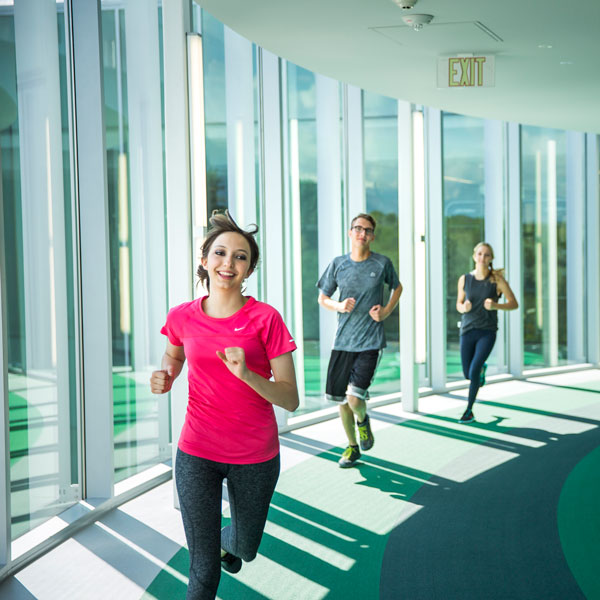 Students running on the UVU indoor track