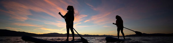 Students paddle boarding on a trip with the UVU Outdoor Adventure Center