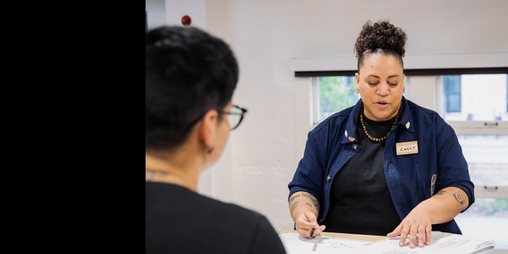 Two women collaborating through a service learning opportunity