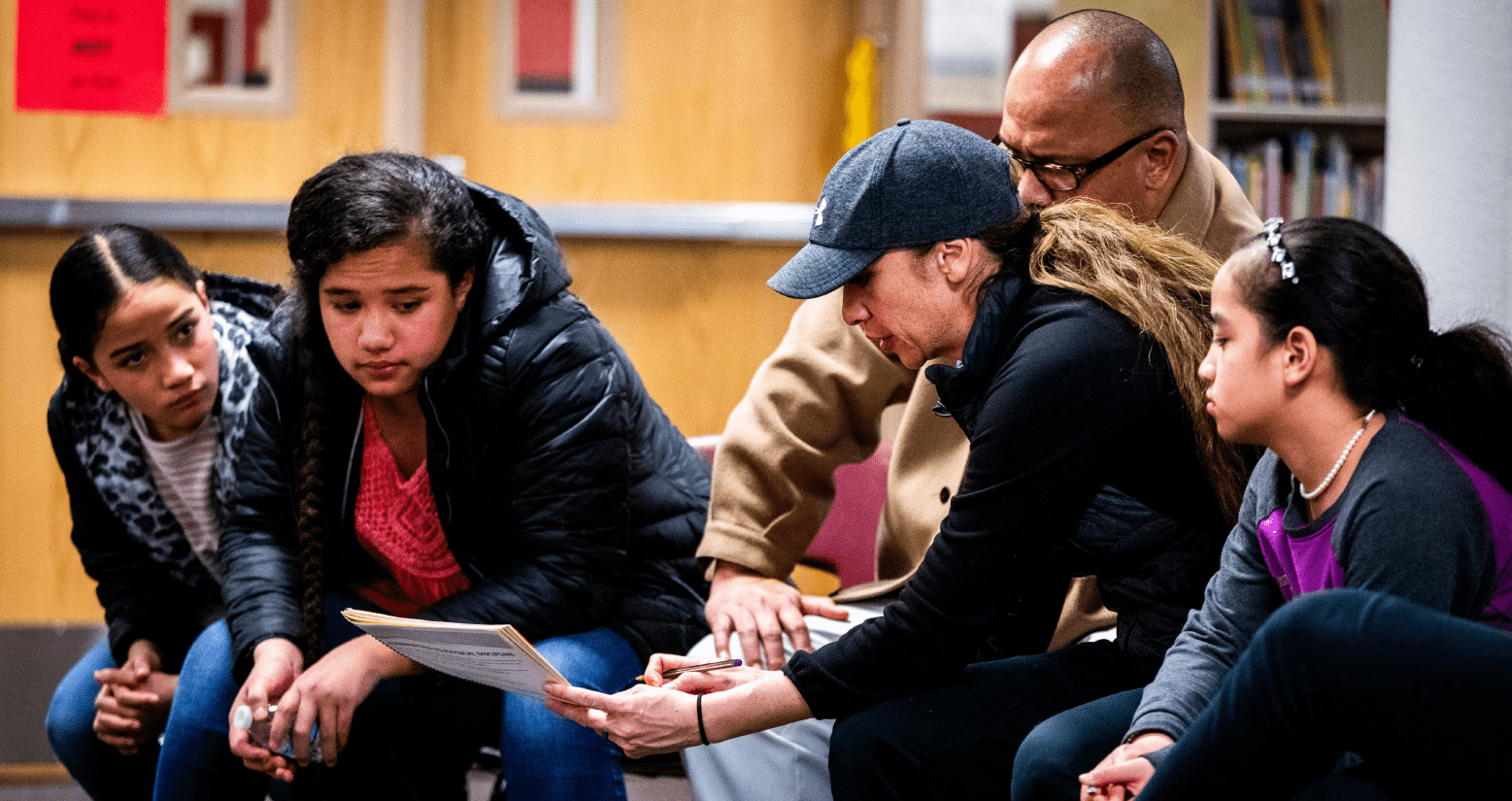 A family studying family life relationship techniques together
