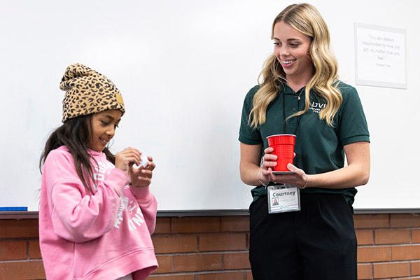SFP intern doing an activity with a child