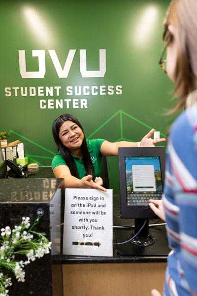Students at the front desk of the Student Success Center