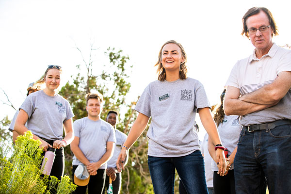 UVU students and teachers in a garden