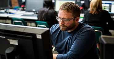 Student using a computer in a lab.