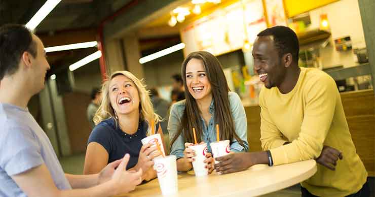 group of people chatting at table