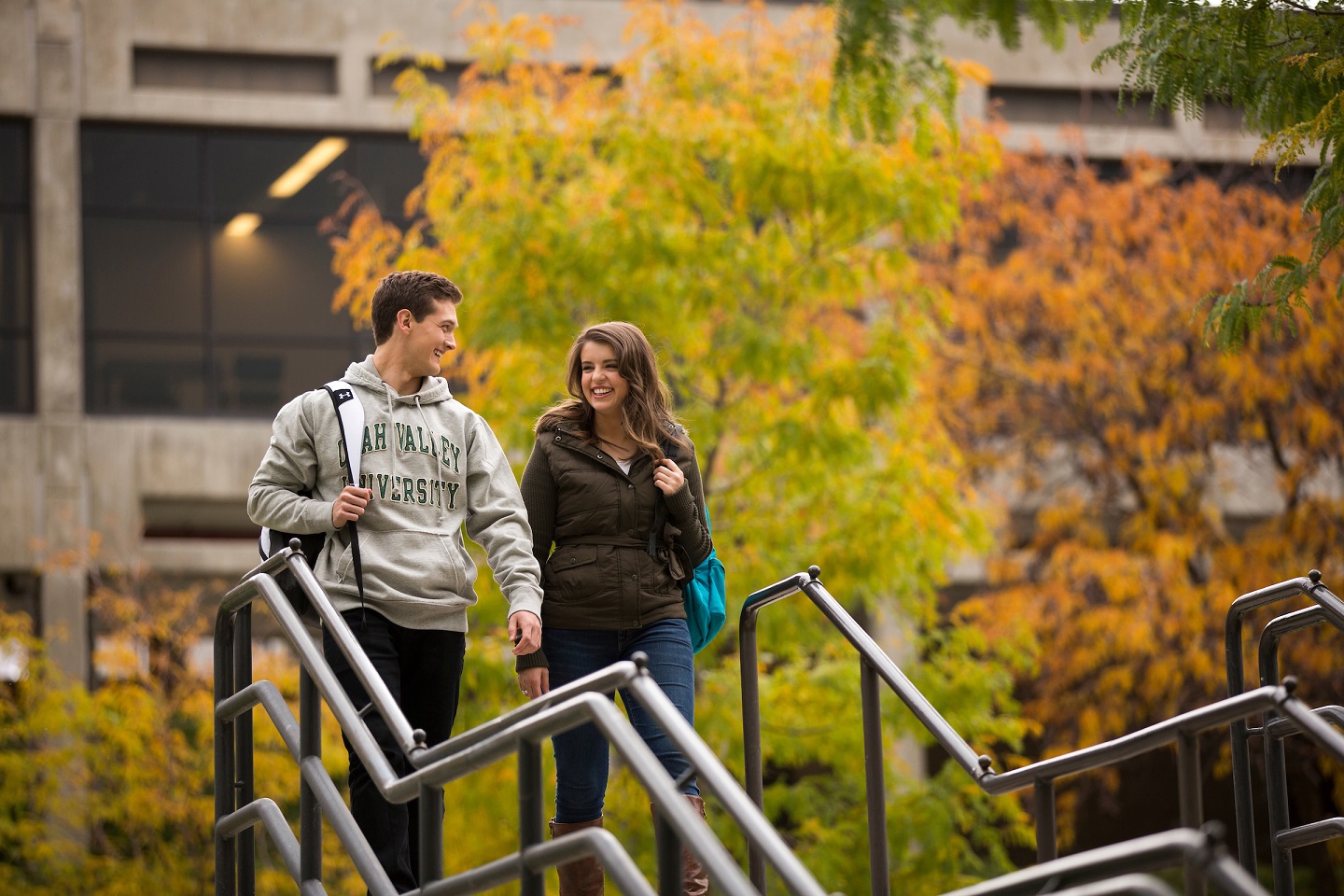 Students walking in the fall down some steps