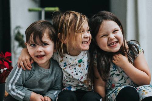 Three kids sidding