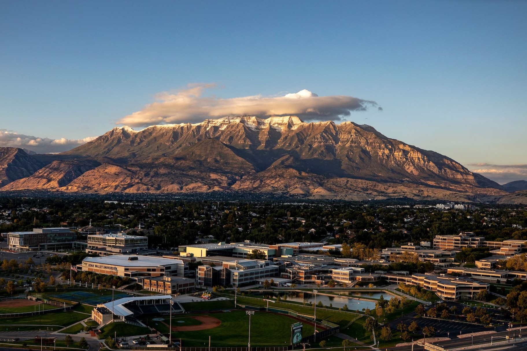 Aerial image of UVU with the City of Orem and Mount Timpanogos in the background