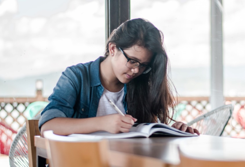 Girl writing in notebook