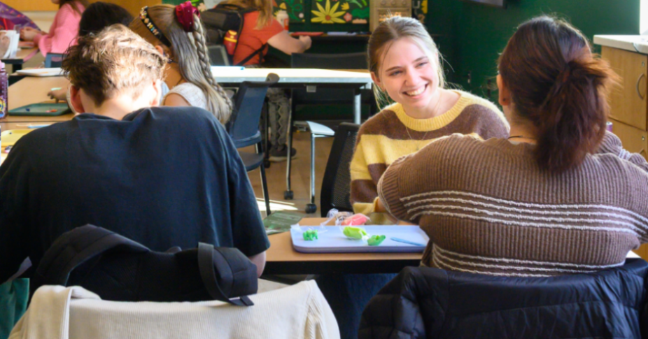 UVU students laughing at clay event in the Zone area