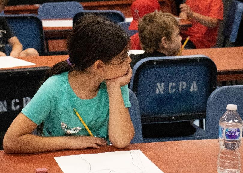 Student reading a play script