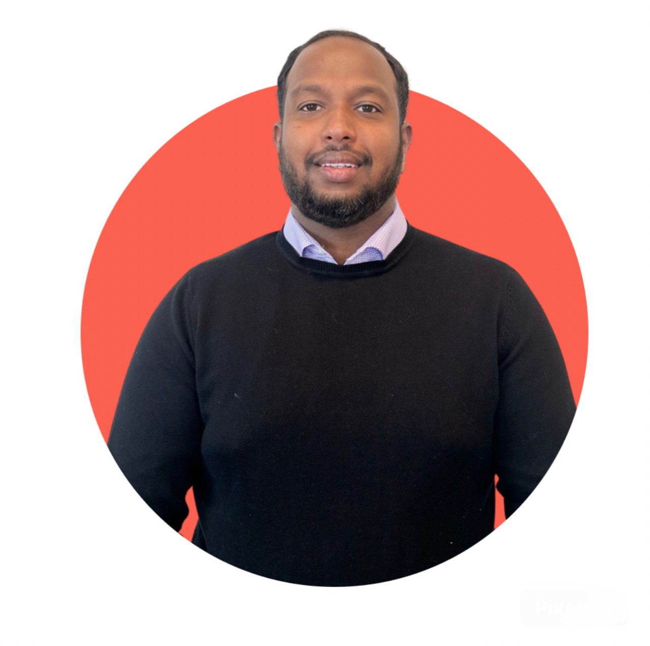 Headshot of Richard Govada Joshua. He is wearing a black sweater