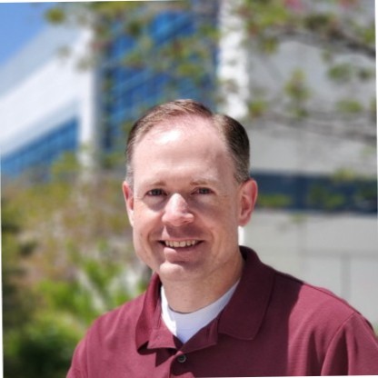 Photo of Kevin Hoyt. Caucasian male with dark hair wearing maroon polo shirt