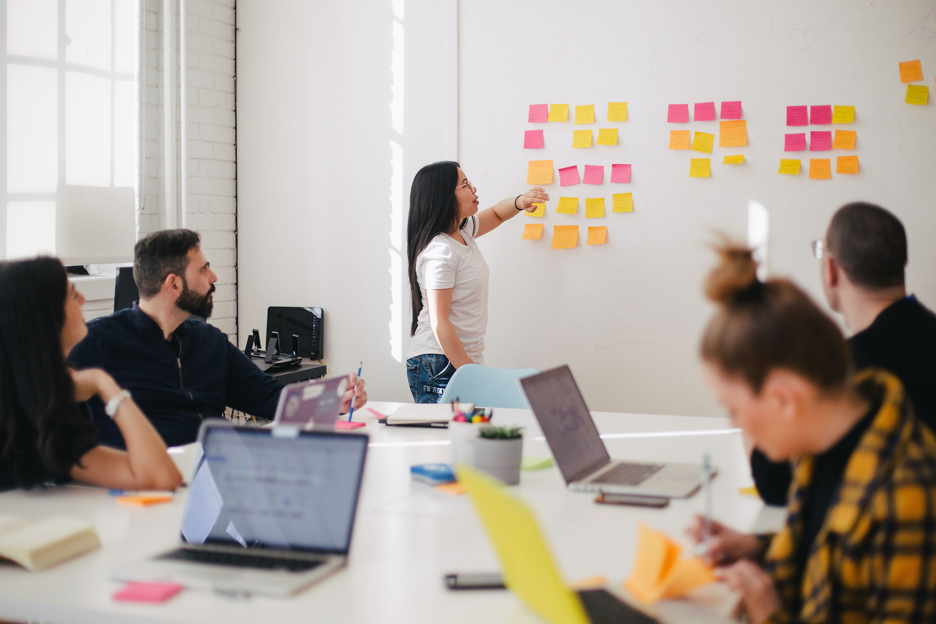 People in meeting brainstorming ideas