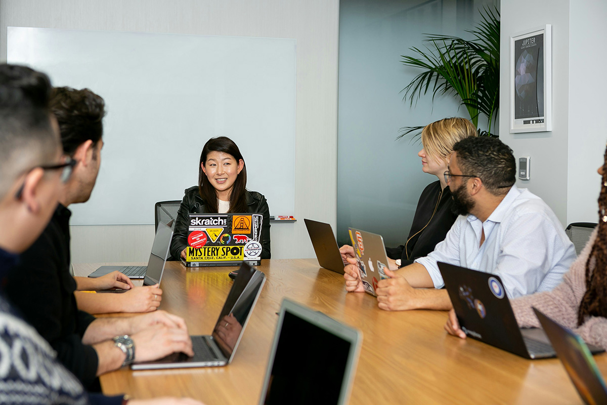 People in a meeting with laptops