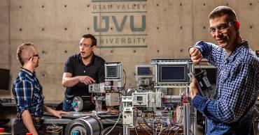 group of people working with robotics equipment