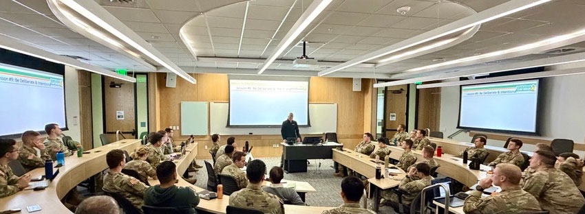 Military students sitting in a classroom listening to a lecture.