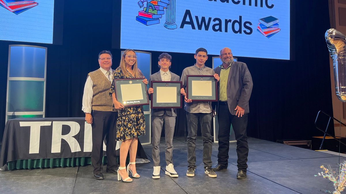 Aliana Molina, Jeffery Payan, and Luis Bryan Zavala, Seniors in Upward Bound, recieve Upward Bound recognition for completing their associates degree