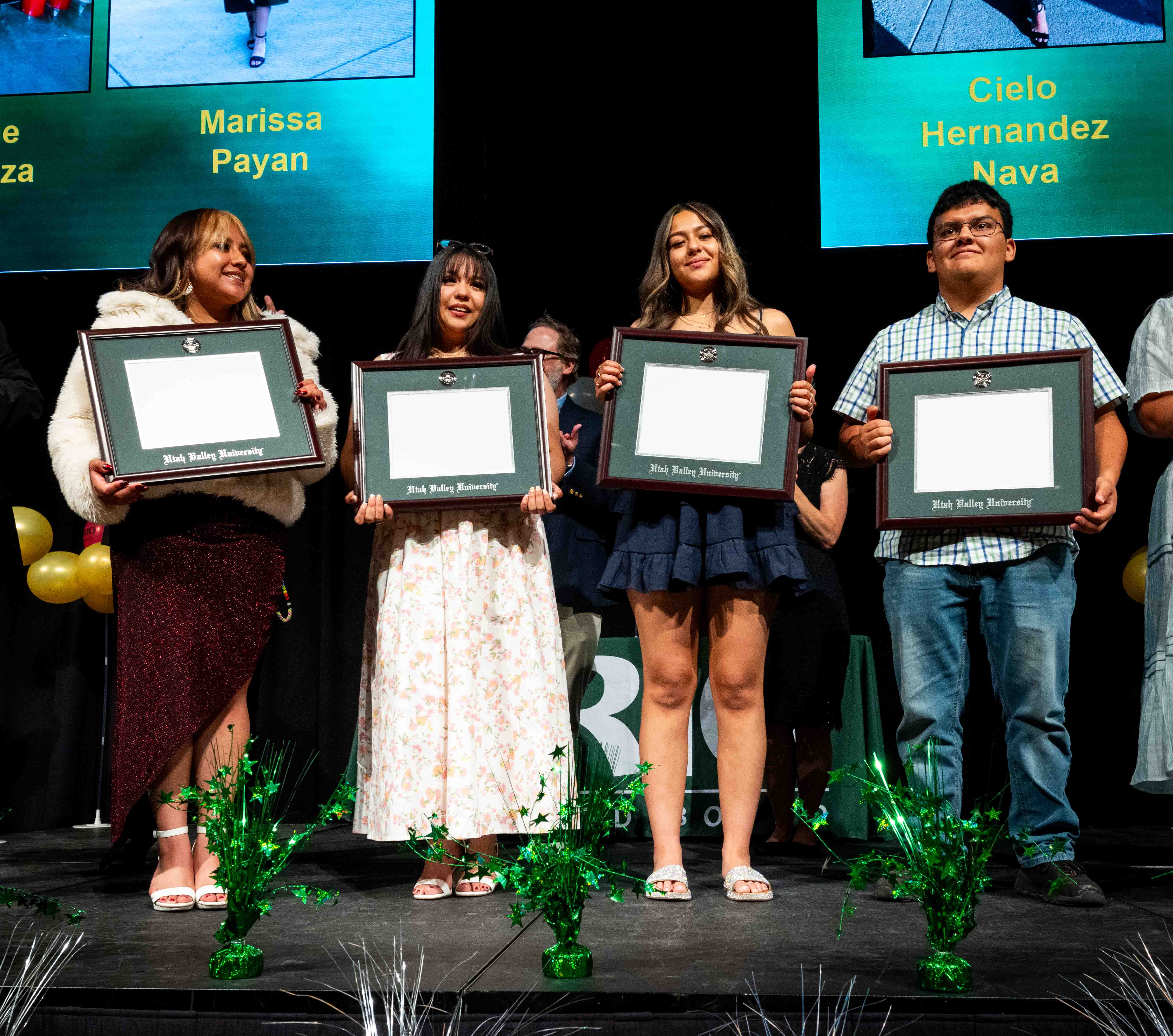 Four upward bound seniors in 2025 receiving associates degree