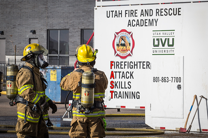 Fireman in full gear surrounded by smoke