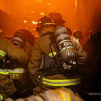 Man studying on a desktop computer in a lab