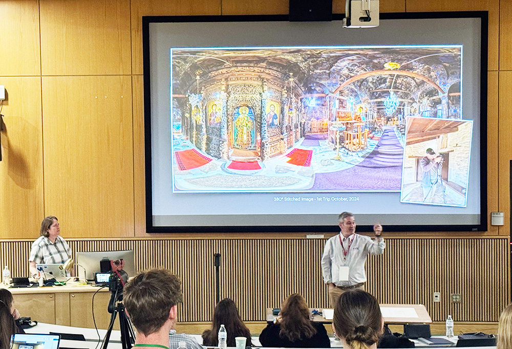 Presenter in front of a screen and students showing LiDAR images of the Agios Achilios of Pentalofos