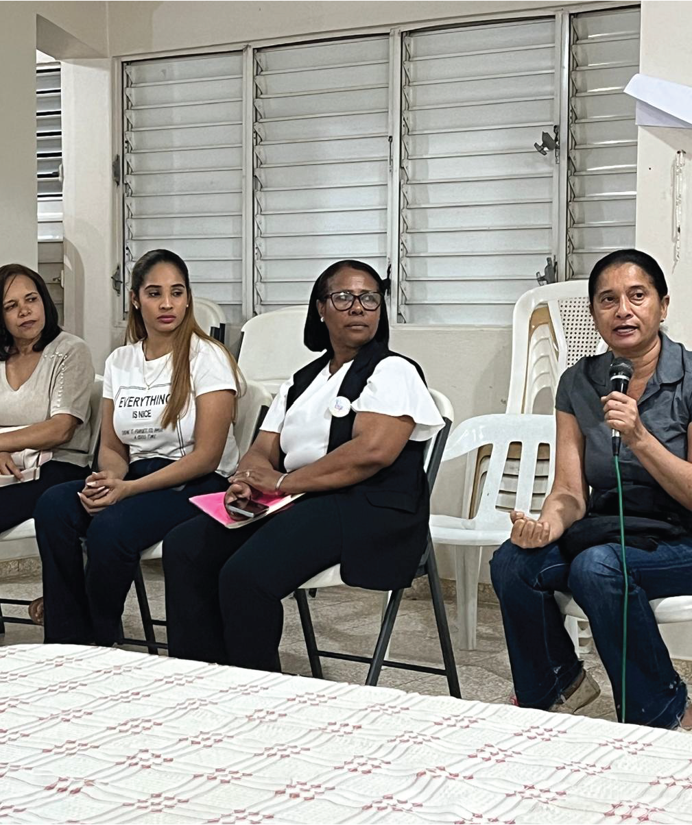 Speaker sitting in a circle surrounded by others