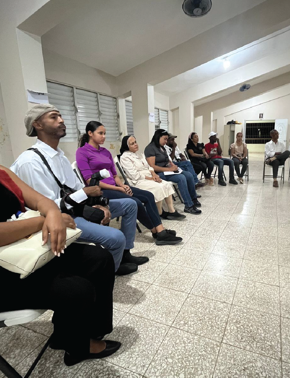 Group of people listening to a speaker