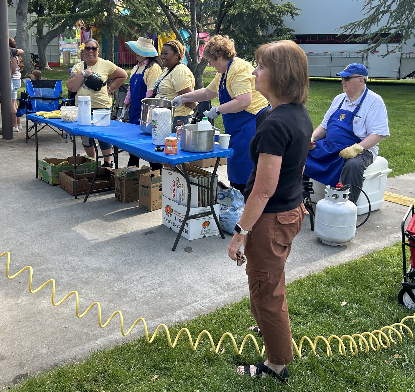 Rotarians Prepare Fruits and Syrup for Pancakes