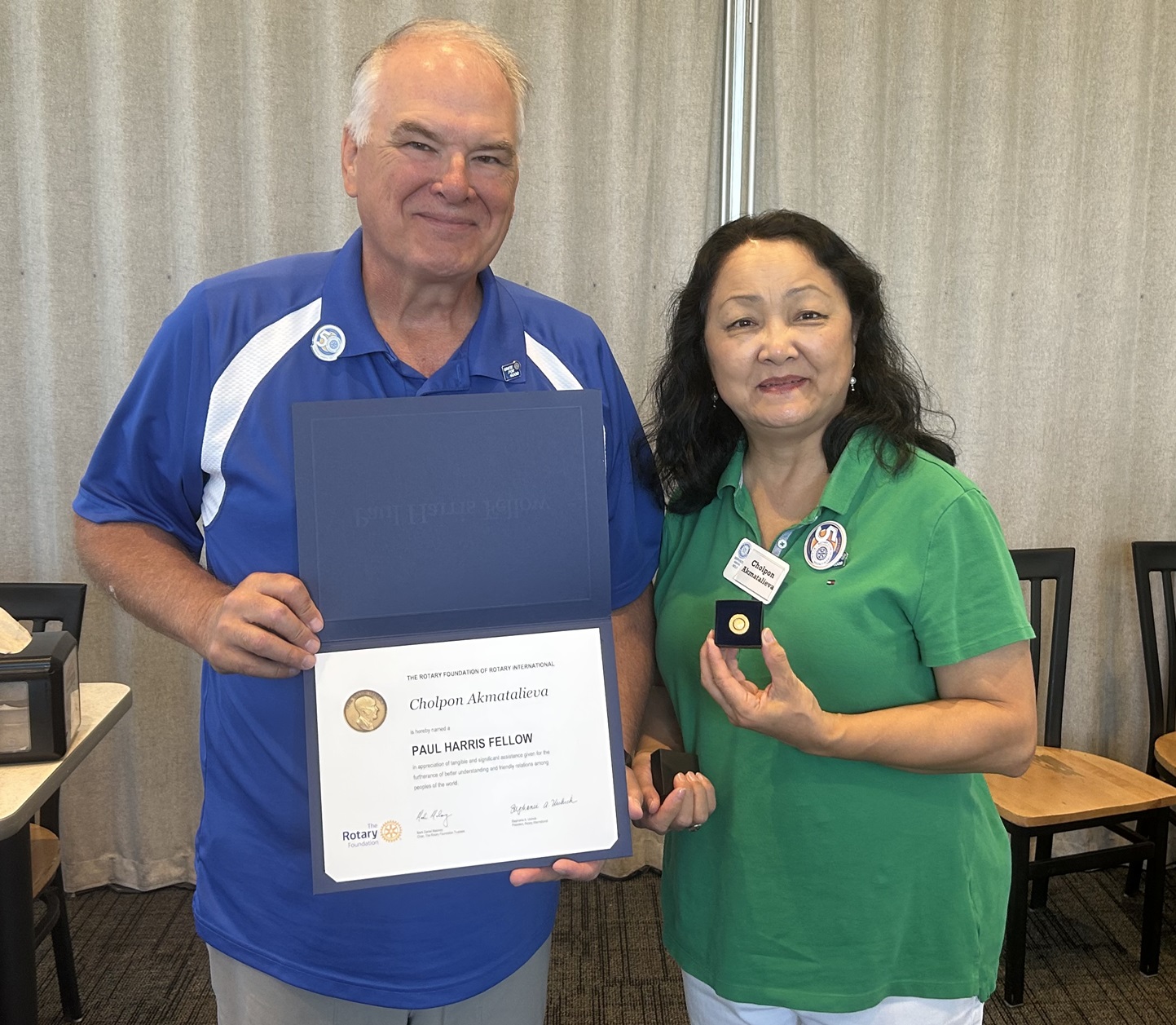Rotarian Cholpon Akmatalieva is receiving her Paul Harris Award for contributions to community services 