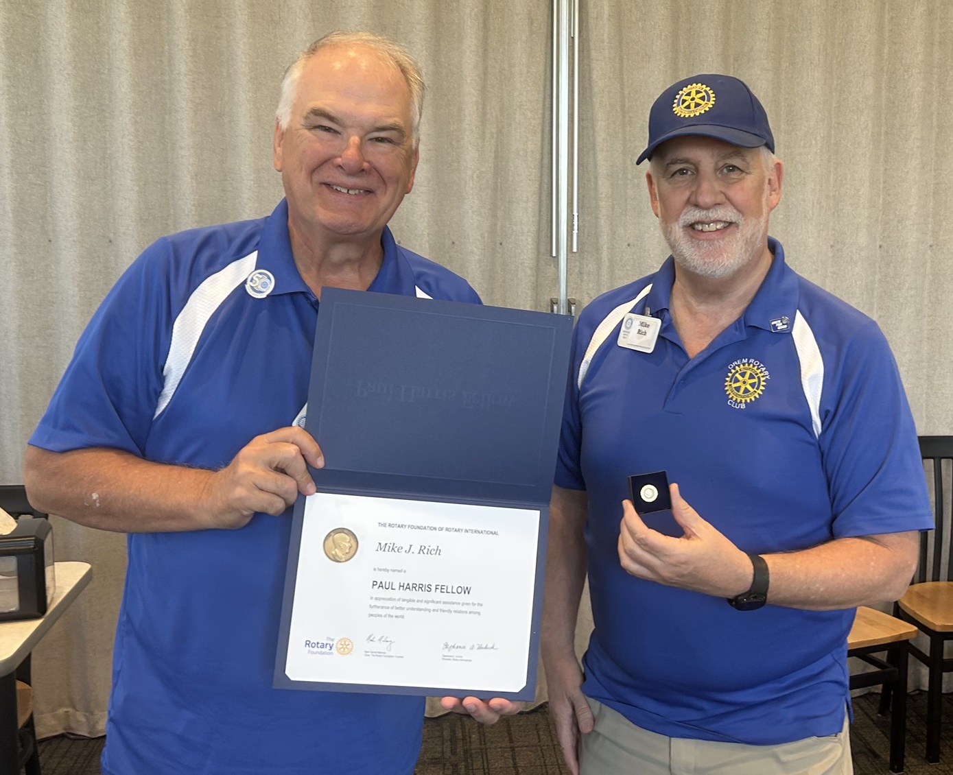 Past President of the Orem-Lindon Rotary Club,  Mike Rich receives  Paul Harris Award from  ast-President of the Orem-Lindon Rotary Club Clark Merkley