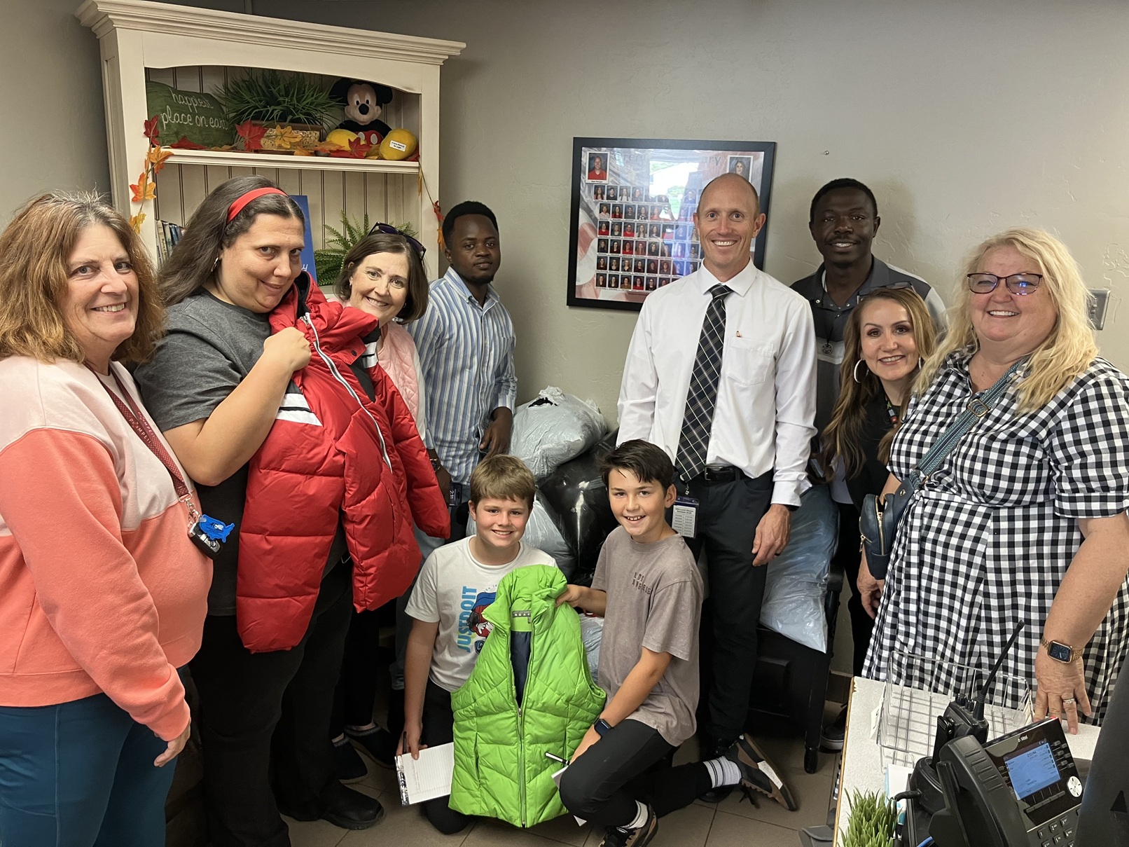 Orem-Lindon Rotary club members, Rotaract members with school coordinators and students from Orem Elementary school.