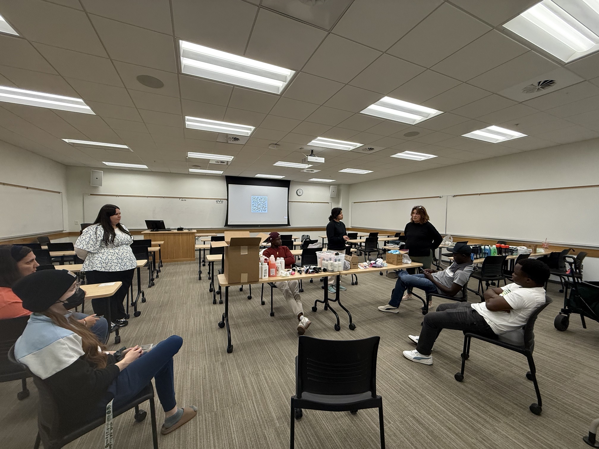 Club members gather to listen to instructions given by Cherise.