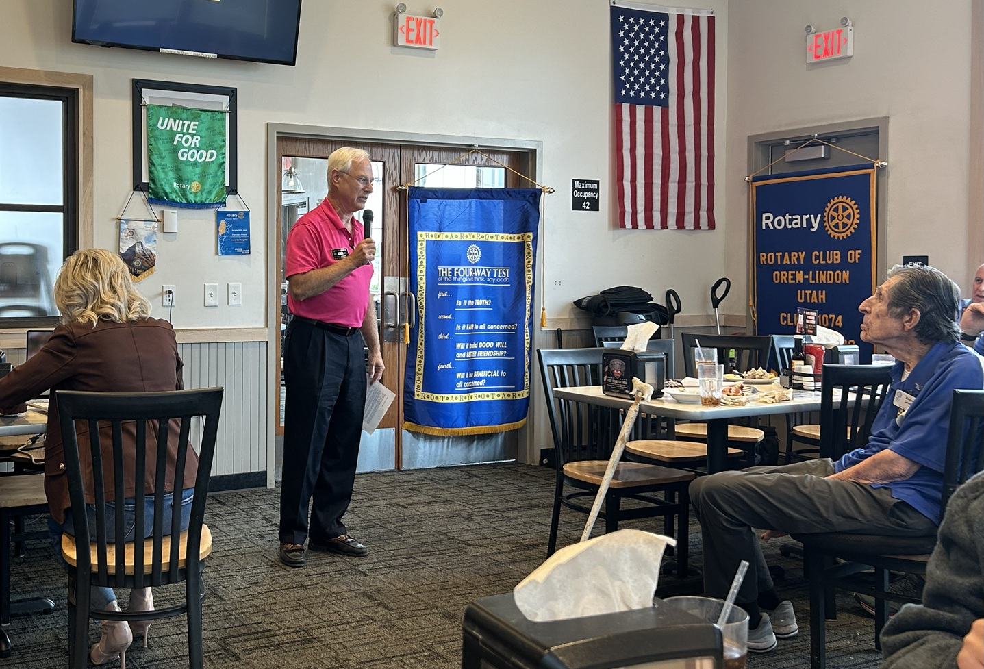 Picture of Chief of Staff Scott Rosenbush introducing District Governor Suzanne Leone.