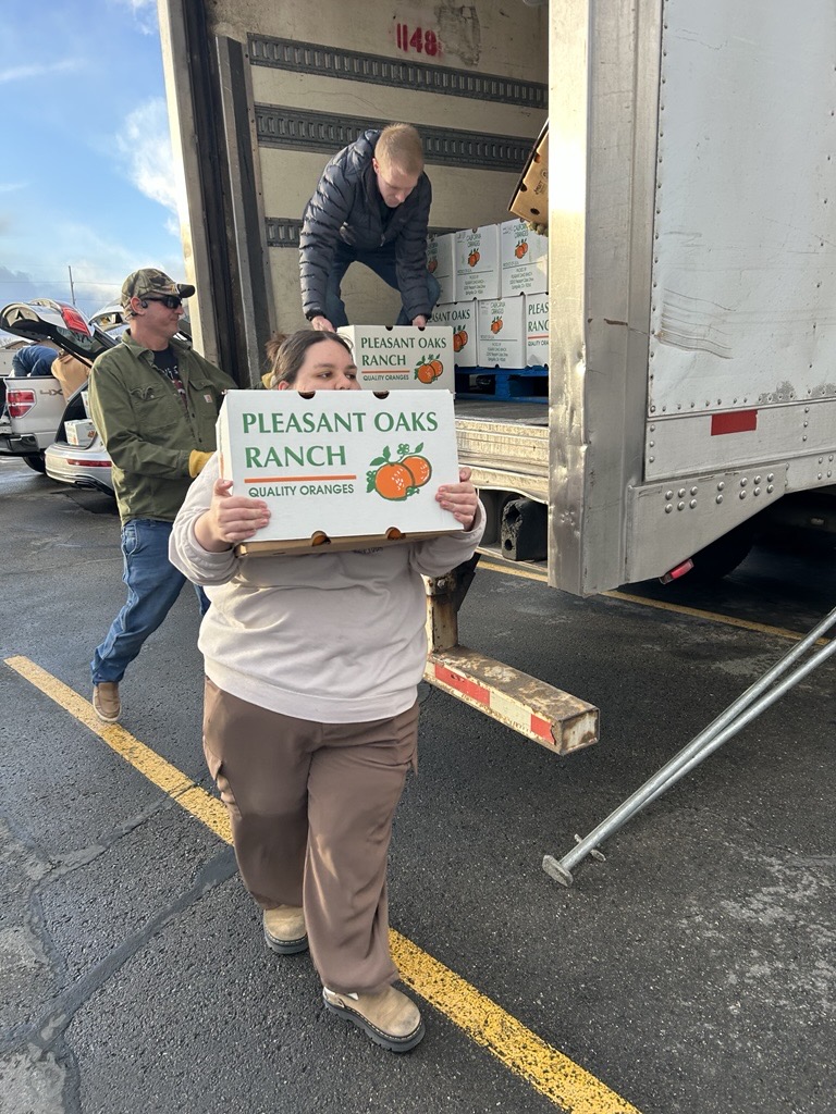Natalia Figueroa Loading Boxes of Citrus  