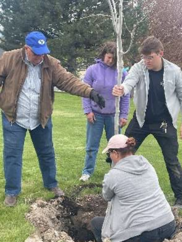  Rotarians and Rotaractors Plant Tree