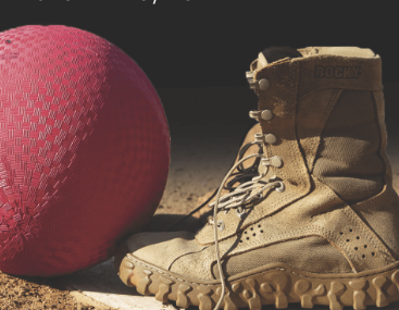 Military boot on a base next to a kickball